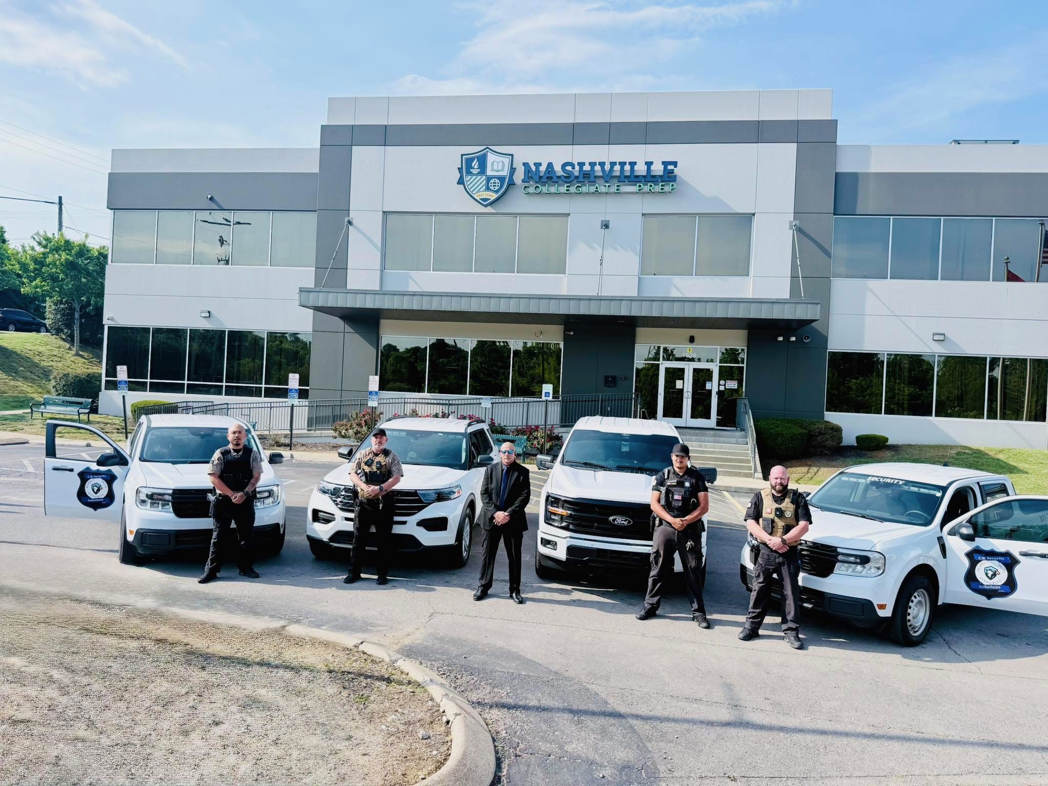 CR Security Solutions Tennessee school security team with marked patrol vehicles at Nashville Collegiate Prep